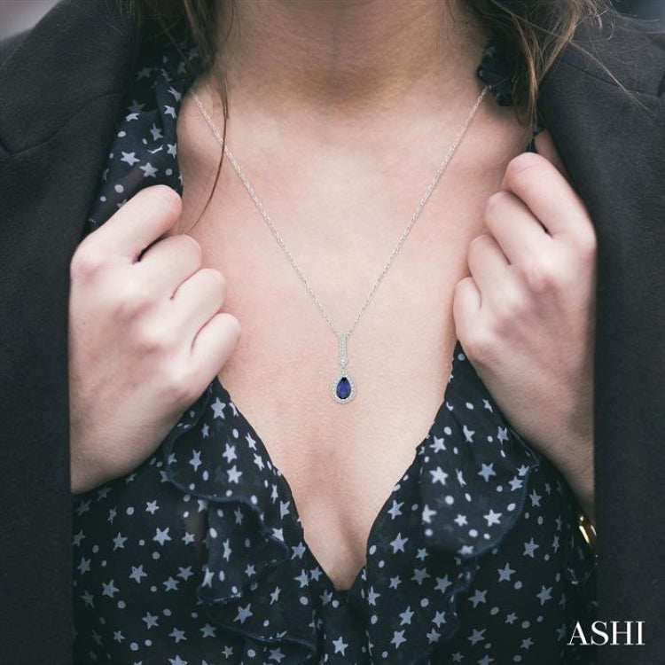 7x5 MM Pear Shape Sapphire and 1/5 Ctw Round Cut Diamond Pendant in 14K White Gold with Chain
