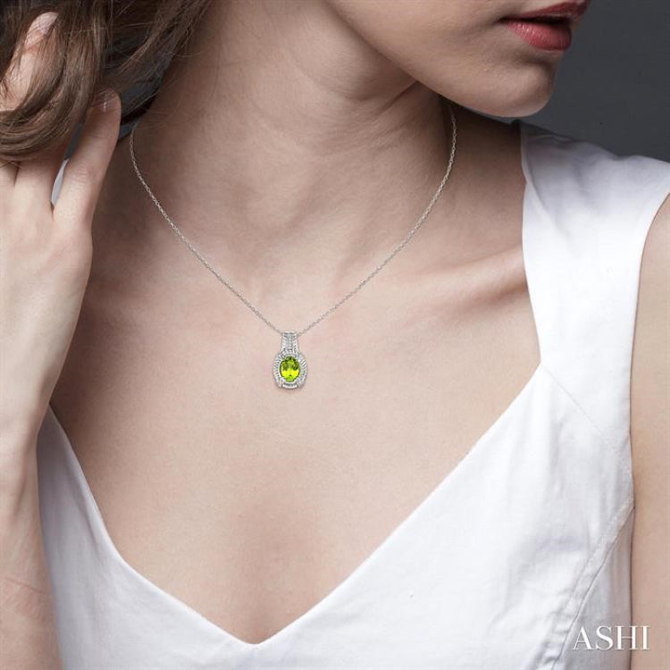 9x7 MM Oval Cut Peridot and 1/50 Ctw Single Cut Diamond Pendant in Sterling Silver with Chain