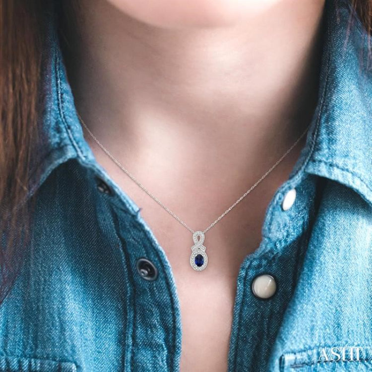 6x4 MM Oval Cut Sapphire and 1/5 Ctw Round Cut Diamond Pendant in 14K White Gold with Chain