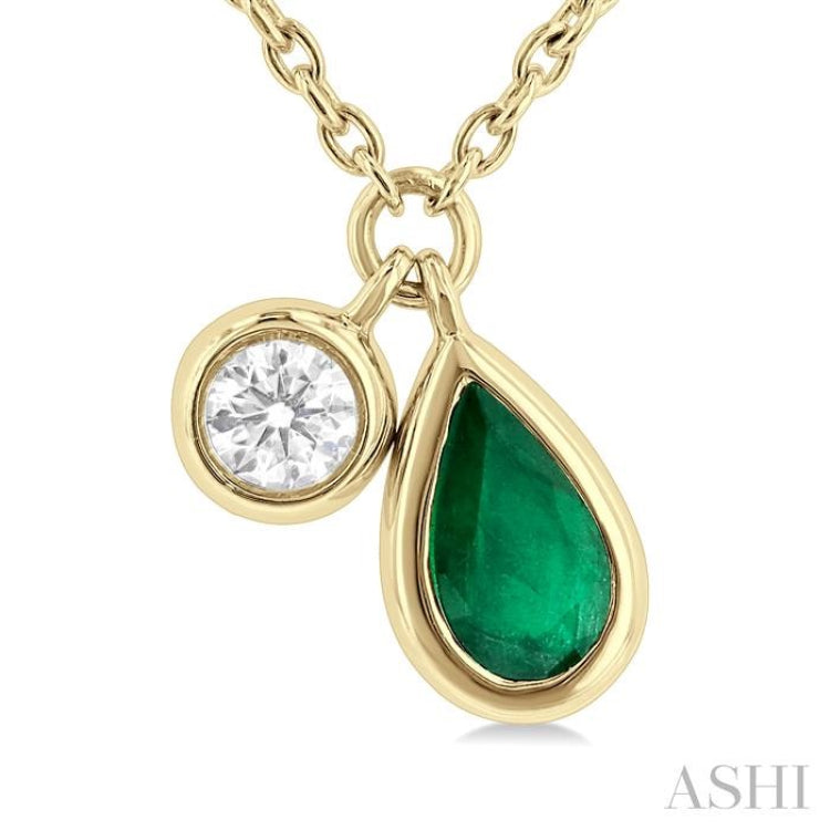 1/50 ctw Pear Cut 6X4MM Emerald and Bezel Set Round Cut Diamond Precious Necklace in 10K Yellow Gold