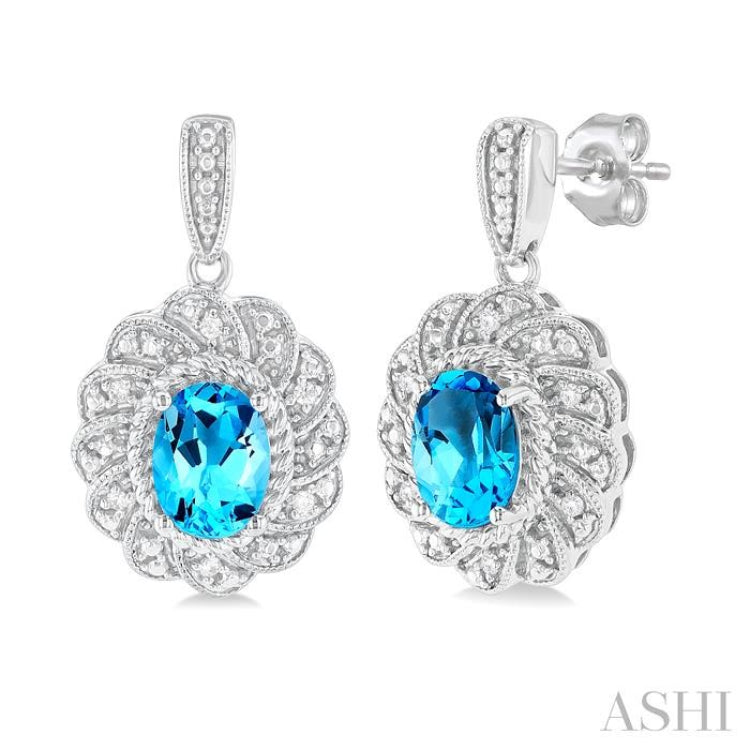 1/20 ctw Oval Cut 7X5MM Blue Topaz and Round Cut Diamond Semi Precious Earring in Sterling Silver