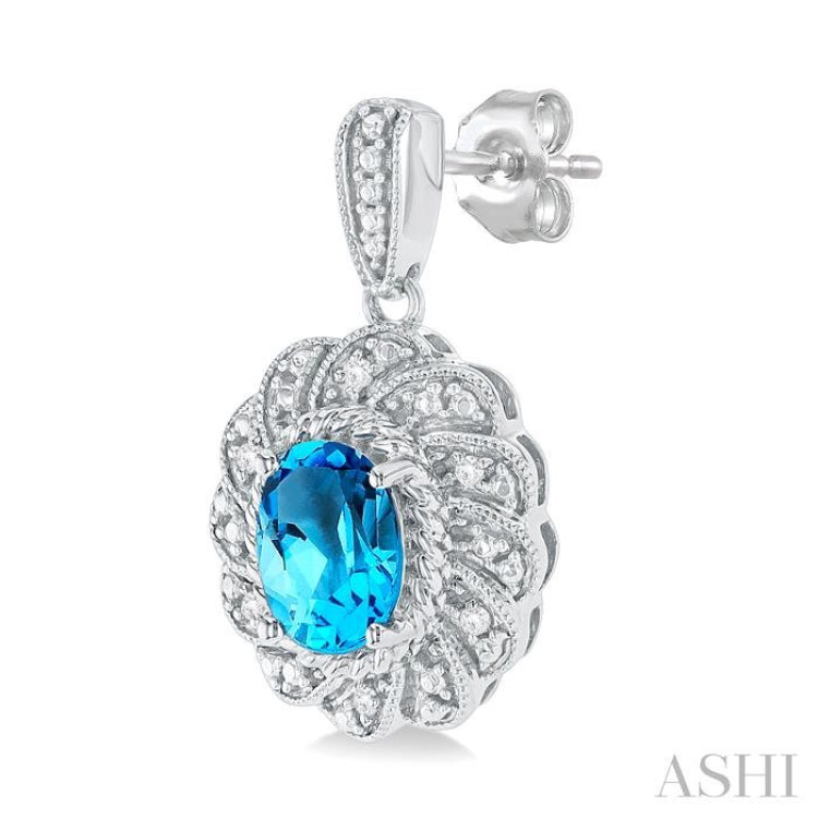 1/20 ctw Oval Cut 7X5MM Blue Topaz and Round Cut Diamond Semi Precious Earring in Sterling Silver