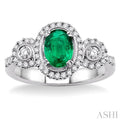 7x5MM Oval Cut Emerald and 1/2 Ctw Round Cut Diamond Ring in 14K White Gold