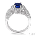 8x6mm Oval Cut Sapphire and 3/4 Ctw Round Cut Diamond Ring in 14K White Gold