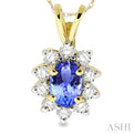 6x4MM Oval Cut Tanzanite and 1/4 Ctw Round Cut Diamond Pendant in 14K Yellow Gold with Chain