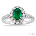 7x5mm Oval Cut Emerald and 1/2 Ctw Round Cut Diamond Ring in 14K White Gold