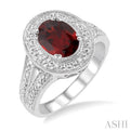 9x7 MM Oval Cut Garnet and 1/20 Ctw Round Cut Diamond Ring in Sterling Silver