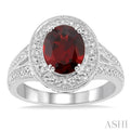 9x7 MM Oval Cut Garnet and 1/20 Ctw Round Cut Diamond Ring in Sterling Silver
