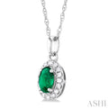 1/20 ctw Round Cut Diamond and 5X3MM Oval Shape Emerald Halo Precious Pendant with Chain in 10K White Gold