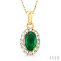 1/20 ctw Round Cut Diamond and 5X3MM Oval Shape Emerald Halo Precious Pendant with Chain in 10K Yellow Gold