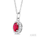 1/20 ctw Round Cut Diamond and 5X3MM Oval Shape Ruby Halo Precious Pendant with Chain in 10K White Gold
