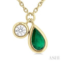 1/50 ctw Pear Cut 6X4MM Emerald and Bezel Set Round Cut Diamond Precious Necklace in 10K Yellow Gold
