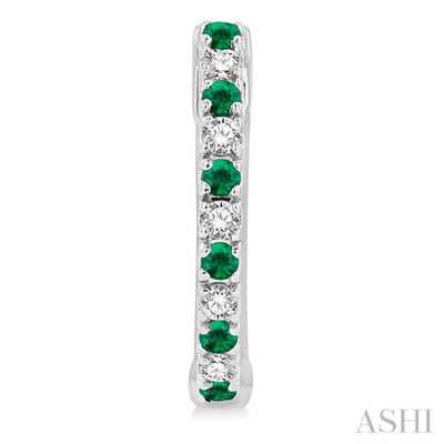 1/10 ctw Petite 1.35MM Emerald and Round Cut Diamond Precious Fashion Huggies in 10K White Gold