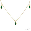 1/4 ctw Round Cut Diamonds and 5X3MM Oval Shape Emerald Precious Station Necklace in 10K Yellow Gold