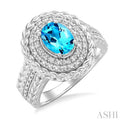 1/20 ctw Oval Cut 9X7MM Blue Topaz and Round Cut Diamond Semi Precious Ring in Sterling Silver