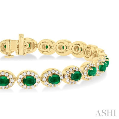 2 1/6 ctw Oval Cut 4X3 MM Emerald and Round Cut Diamond Halo Precious Tennis Bracelet in 14K Yellow Gold
