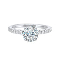 Classic and ready to make you shine, this ring features diamonds set in pave with a center solitaire.