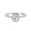 Petite set diamonds adds excitement to this classic solitaire ring perfectly showcases timeless love for her.