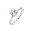Petite set diamonds adds excitement to this classic solitaire ring perfectly showcases timeless love for her.