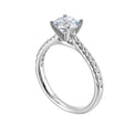 Petite set diamonds adds excitement to this classic solitaire ring perfectly showcases timeless love for her.