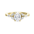 Elongated oval diamond takes center stage, framed by graceful trinity of marquise diamonds set on either side followed by a pinch shank is sure to flatten her.