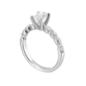 A magnificent oval diamond takes center stage, framed by a breathtaking alternation of fancy and round diamonds is sure to delight her.