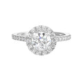 Dazzle with classic round solitaire framed by a sparkling halo. The studded shank adds a touch of classic look, making this ring a timeless symbol of elegance.