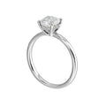 The dazzling solitaire diamond take center stage. The petite band adds to the sleek, classic look.
