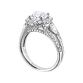 Start your love story with sparkles of this marquise and round diamond three stone engagement ring. The three rows shank have a beautiful split with pave studded diamonds on the sides.