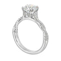 Stunning with a round solitaire diamond set in dual prongs atop a modern crisscross band. The unique twist on timeless elegance is perfect for the modern bride.